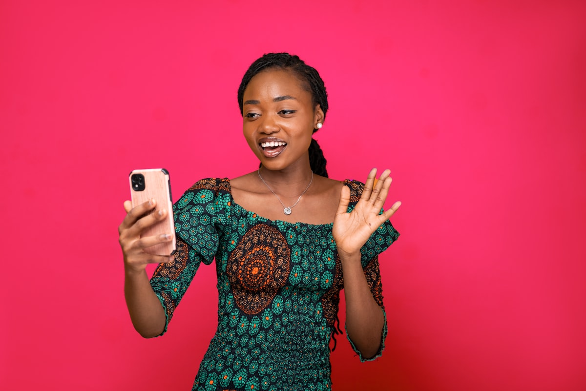 A Mile Global Markets trader checking her phone